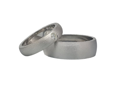 Unusual matte silver wedding rings with cubic zirconia