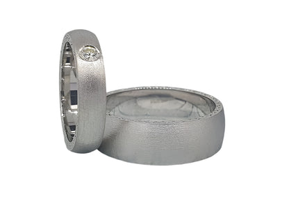 Unusual matte silver wedding rings with cubic zirconia