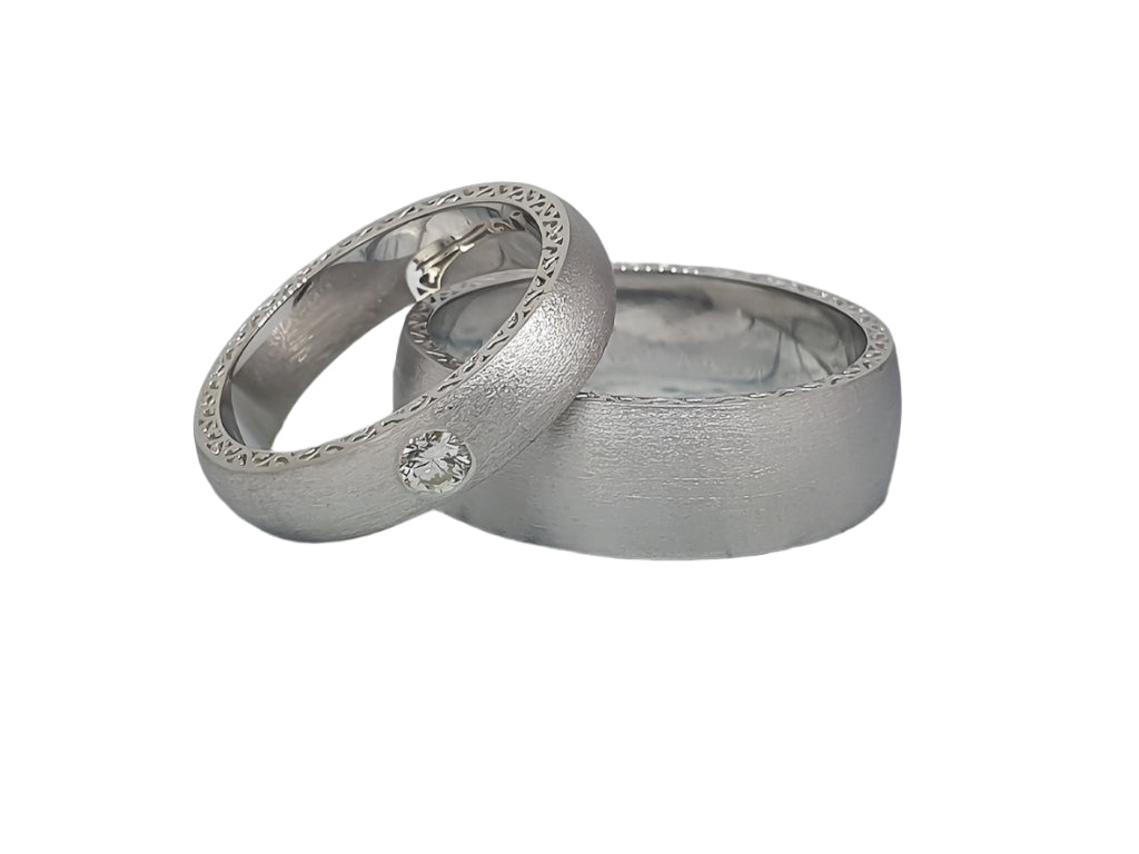 Unusual matte silver wedding rings with cubic zirconia